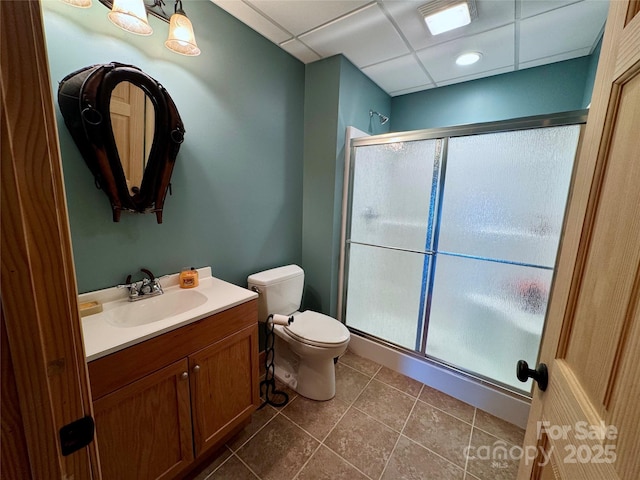 658 Green Point Ln, Boomer, NC 28606 - bathroom with a stall shower, vanity, a paneled ceiling, and tile patterned flooring