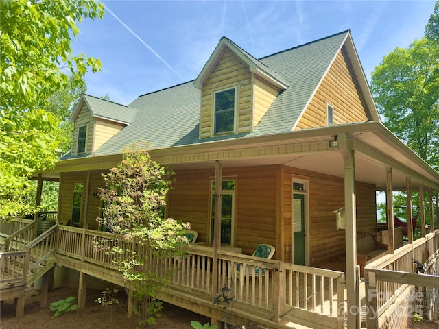 658 Green Point Ln, Boomer, NC 28606 - view of property exterior with covered porch, a shingled roof, and faux log siding