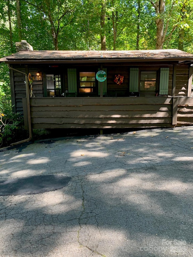 37 Sassafras Ln, Maggie Valley, NC 28751 - view of front facade with a chimney
