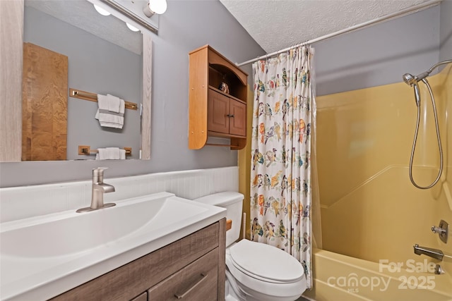 37 Sassafras Ln, Maggie Valley, NC 28751 - full bath featuring vanity, shower / bath combo with shower curtain, a textured ceiling, and wainscoting