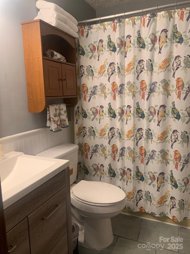 37 Sassafras Ln, Maggie Valley, NC 28751 - full bathroom with vanity, tile patterned flooring, and a shower with curtain