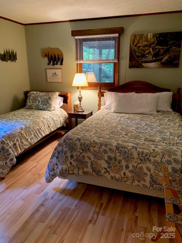 37 Sassafras Ln, Maggie Valley, NC 28751 - bedroom with crown molding and wood finished floors