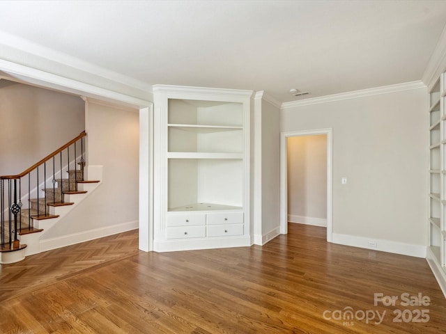 1522 High St, Charlotte, NC 28211 - unfurnished living room with crown molding, stairway, built in shelves, baseboards, and wood finished floors