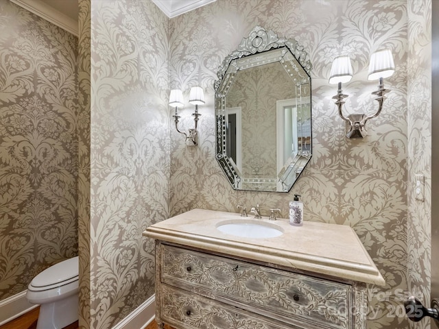 1522 High St, Charlotte, NC 28211 - bathroom featuring wallpapered walls, toilet, vanity, and crown molding