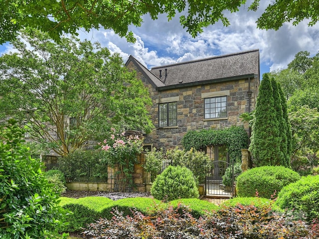 1522 High St, Charlotte, NC 28211 - view of home's exterior with stone siding and roof with shingles