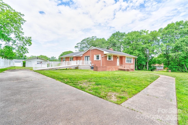 800 Charles Rd, Shelby, NC 28150 - view of front of home featuring brick siding, a chimney, concrete driveway, a front lawn, and an outbuilding