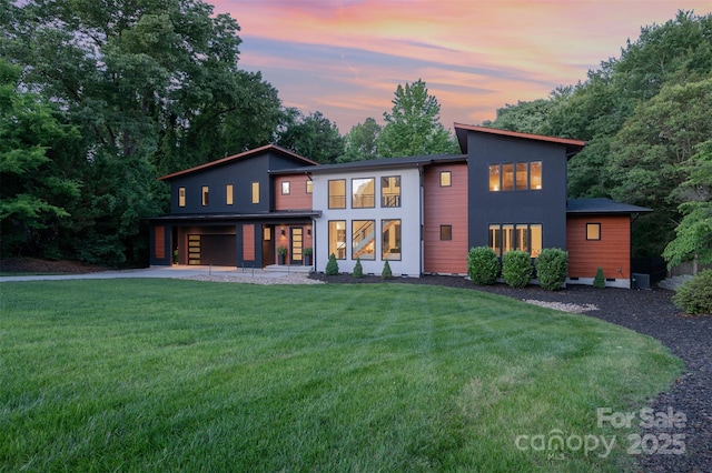 5925 Creola Rd, Charlotte, NC 28270 - view of front facade featuring gravel driveway, an attached garage, and a front lawn