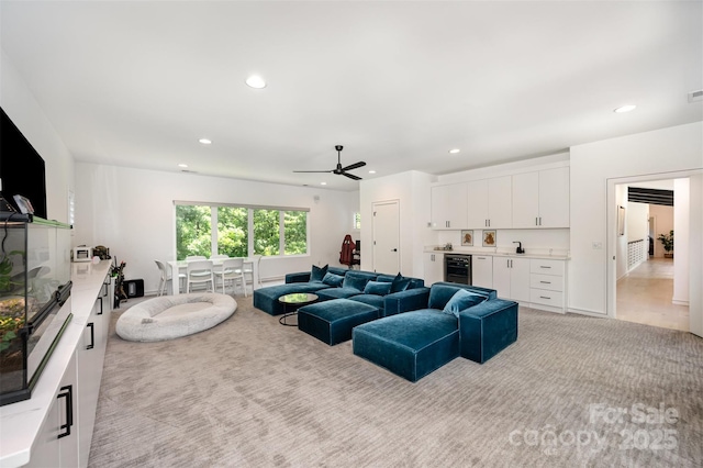5925 Creola Rd, Charlotte, NC 28270 - living room with beverage cooler, bar, recessed lighting, light carpet, and a ceiling fan