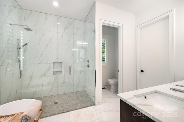 5925 Creola Rd, Charlotte, NC 28270 - full bathroom with marble look tiles, a marble finish shower, vanity, toilet, and a freestanding bath