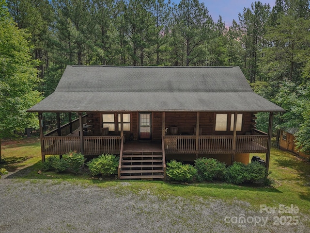 145 Jobes Trl, Mill Spring, NC 28756 - cabin featuring log exterior, a wooden deck, and a shingled roof