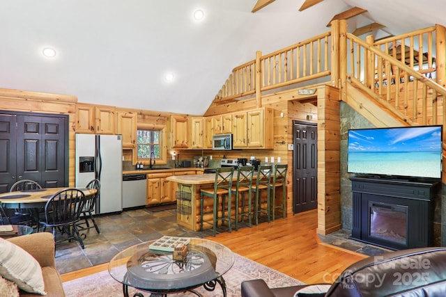 145 Jobes Trl, Mill Spring, NC 28756 - living area featuring a fireplace with flush hearth, high vaulted ceiling, stairs, and recessed lighting