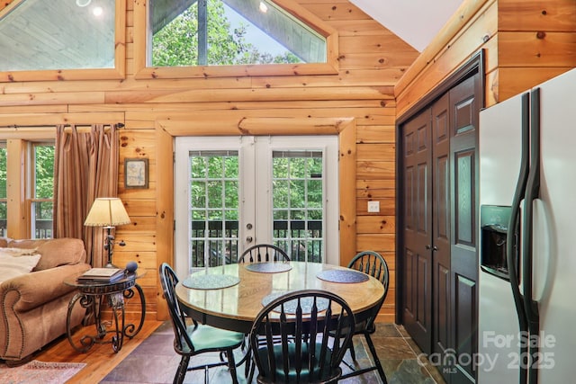 145 Jobes Trl, Mill Spring, NC 28756 - dining space featuring high vaulted ceiling, french doors, and wood walls
