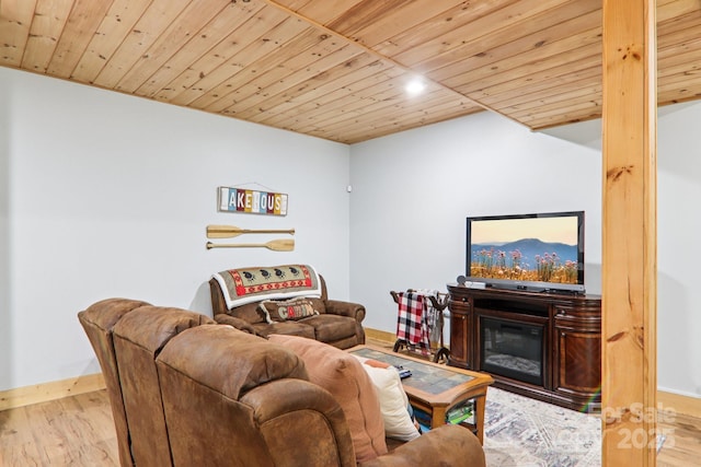 145 Jobes Trl, Mill Spring, NC 28756 - living area featuring wooden ceiling, wood finished floors, baseboards, recessed lighting, and a glass covered fireplace