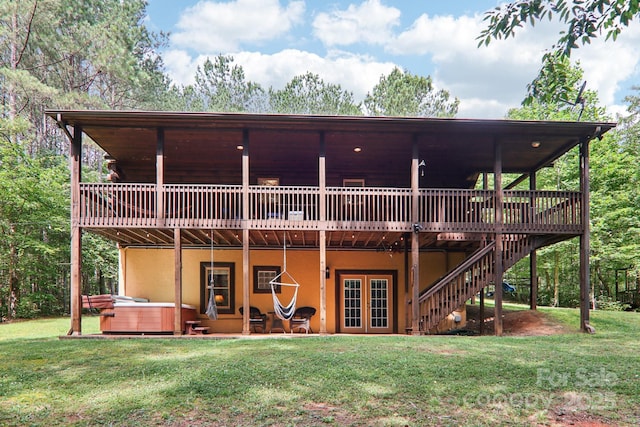 145 Jobes Trl, Mill Spring, NC 28756 - rear view of house with a hot tub, a wooden deck, french doors, and a yard