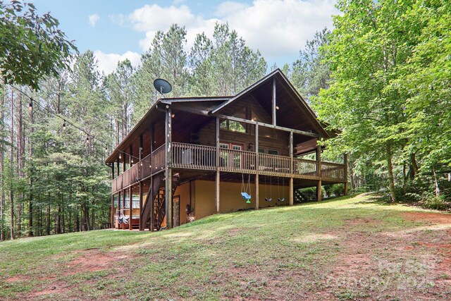 145 Jobes Trl, Mill Spring, NC 28756 - back of property featuring a deck, a lawn, and stairway