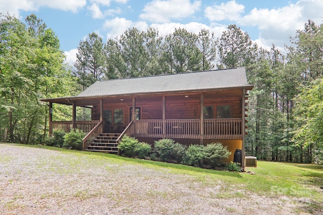 145 Jobes Trl, Mill Spring, NC 28756 - view of front of property with central AC unit, a front yard, and a shingled roof