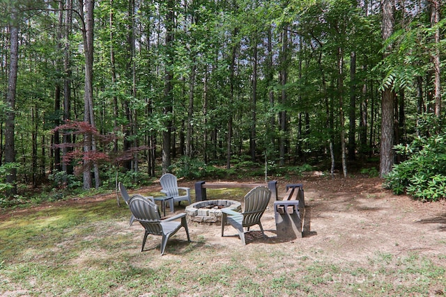 145 Jobes Trl, Mill Spring, NC 28756 - view of yard with an outdoor fire pit and a forest view