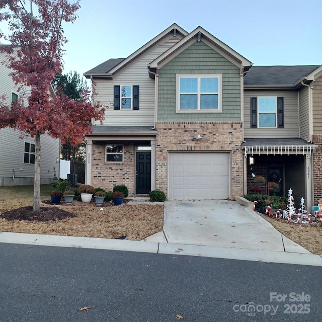 8039 Scarlet Oak Ter, Fort Mill, SC 29707 - view of front of home featuring brick siding, concrete driveway, and a garage