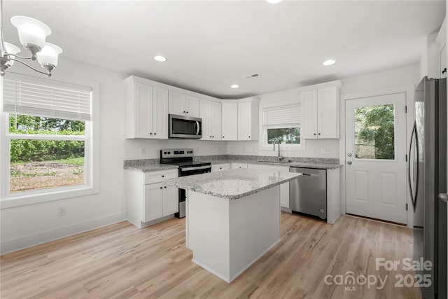 208 N Correll St, Landis, NC 28025 - kitchen featuring stainless steel appliances, a sink, white cabinetry, and recessed lighting