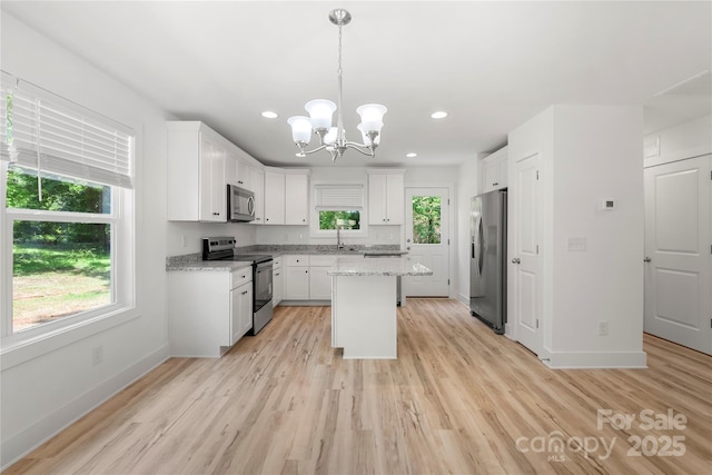 208 N Correll St, Landis, NC 28025 - kitchen featuring stainless steel appliances, a chandelier, white cabinets, and recessed lighting