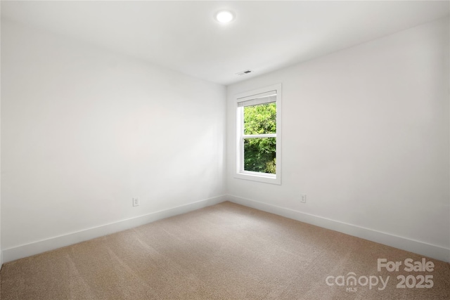 208 N Correll St, Landis, NC 28025 - spare room with light colored carpet, baseboards, and recessed lighting
