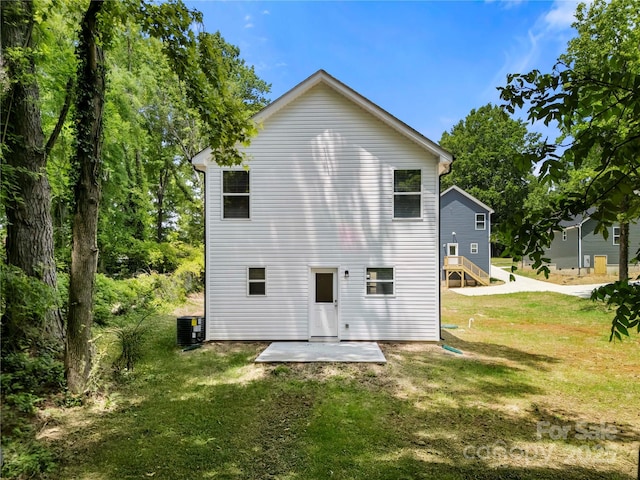 208 N Correll St, Landis, NC 28025 - rear view of house with a yard, a patio area, and cooling unit