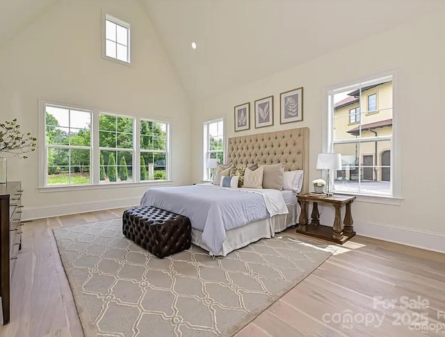 7209 Alexander Rd Unit 3, Charlotte, NC 28270 - bedroom with baseboards, high vaulted ceiling, wood finished floors, and recessed lighting