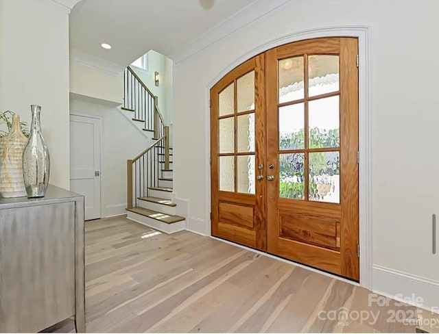 7209 Alexander Rd Unit 3, Charlotte, NC 28270 - entryway featuring french doors, light wood-type flooring, stairway, baseboards, and arched walkways