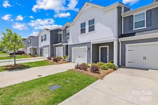1563 Old Rivers Rd, Concord, NC 28027 - view of property with concrete driveway, a garage, a residential view, board and batten siding, and a front yard