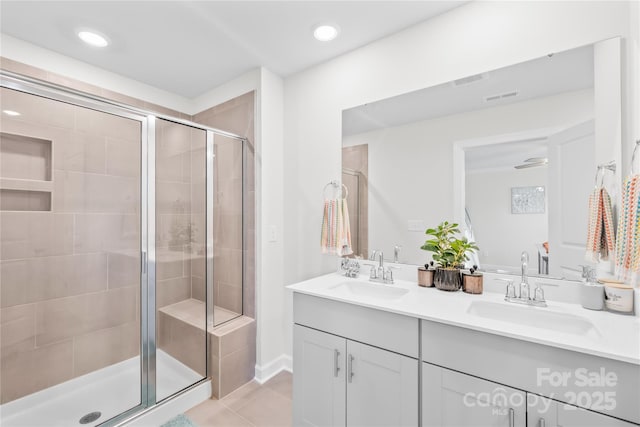 1563 Old Rivers Rd, Concord, NC 28027 - full bathroom with double vanity, a stall shower, tile patterned floors, and recessed lighting