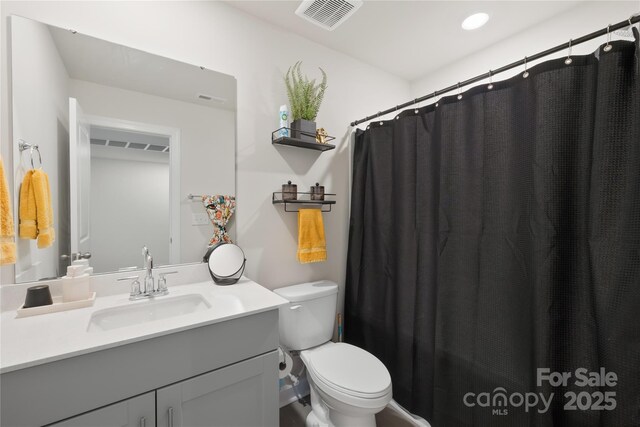 1563 Old Rivers Rd, Concord, NC 28027 - full bathroom with vanity, toilet, and a shower with curtain