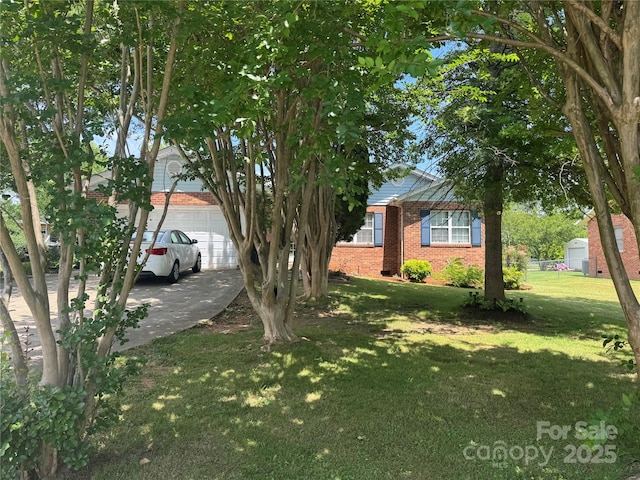 2104 2nd Ave NW, Hickory, NC 28601 - view of property hidden behind natural elements with brick siding, a front lawn, a garage, and concrete driveway