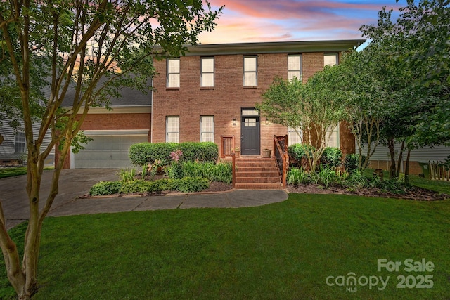 16028 Cranleigh Dr, Huntersville, NC 28078 - colonial-style house with a front yard, driveway, brick siding, and a garage
