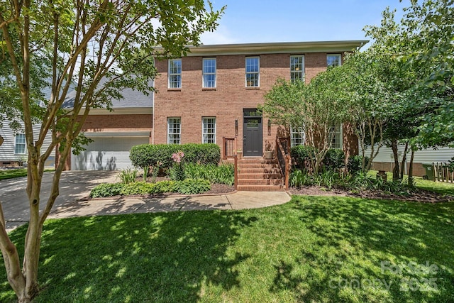 16028 Cranleigh Dr, Huntersville, NC 28078 - colonial house with brick siding, a garage, a front lawn, and driveway