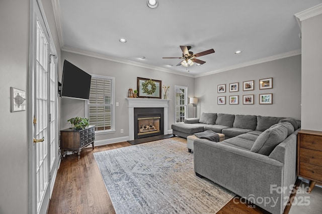 16028 Cranleigh Dr, Huntersville, NC 28078 - living room with a ceiling fan, recessed lighting, wood finished floors, a glass covered fireplace, and crown molding
