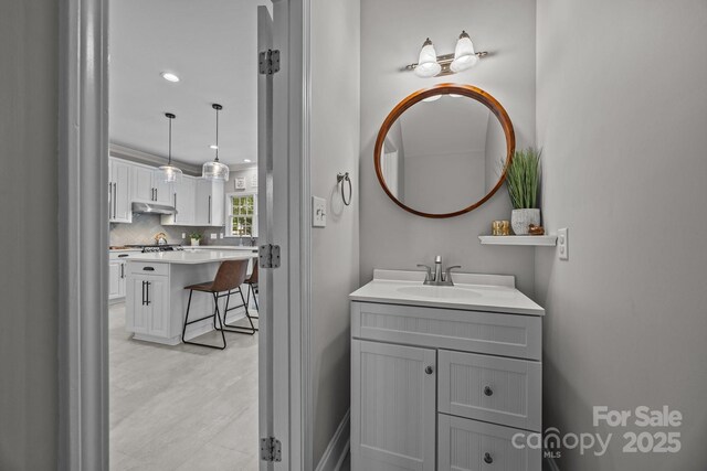16028 Cranleigh Dr, Huntersville, NC 28078 - bathroom featuring a sink, backsplash, and recessed lighting