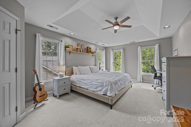 16028 Cranleigh Dr, Huntersville, NC 28078 - bedroom with a tray ceiling, carpet floors, baseboards, multiple windows, and recessed lighting