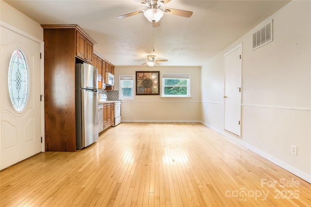 13 Rosscraggon Dr, Asheville, NC 28803 - kitchen with white appliances, brown cabinets, ceiling fan, and light wood finished floors