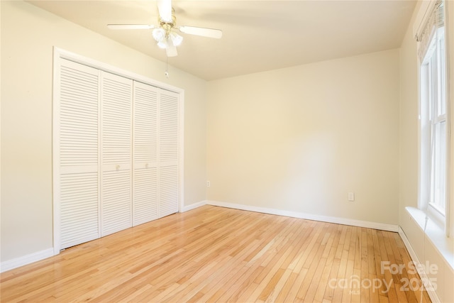13 Rosscraggon Dr, Asheville, NC 28803 - unfurnished bedroom with hardwood / wood-style flooring, a closet, and a ceiling fan