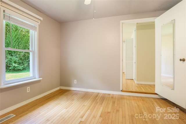 13 Rosscraggon Dr, Asheville, NC 28803 - spare room with light wood-style flooring and ceiling fan