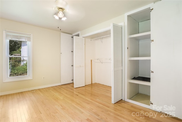 13 Rosscraggon Dr, Asheville, NC 28803 - unfurnished bedroom featuring light wood-type flooring and a closet