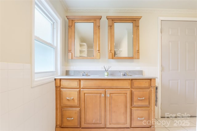 13 Rosscraggon Dr, Asheville, NC 28803 - full bath featuring double vanity, tile walls, and wainscoting