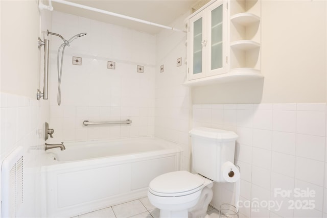 13 Rosscraggon Dr, Asheville, NC 28803 - bathroom featuring tile walls, tile patterned flooring, shower / bath combination, and wainscoting