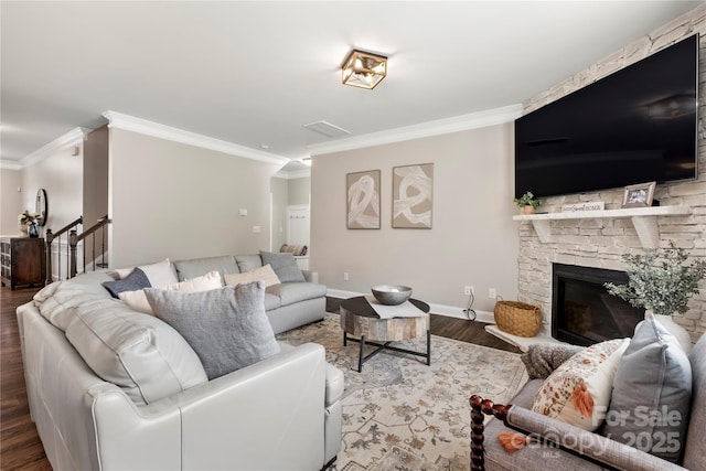 3009 Lydney Cir, Waxhaw, NC 28173 - living room with wood finished floors, ornamental molding, baseboards, and a stone fireplace