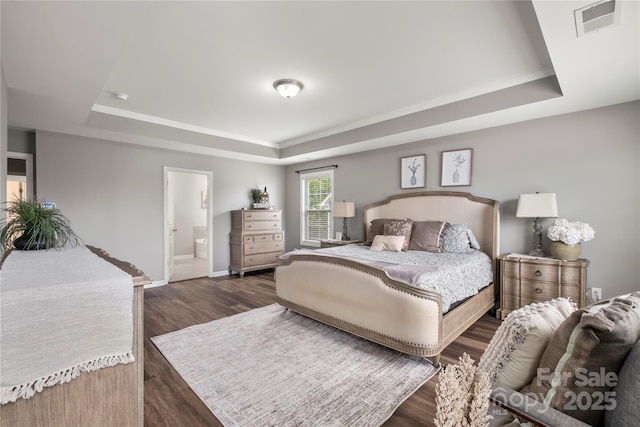 3009 Lydney Cir, Waxhaw, NC 28173 - bedroom with a raised ceiling, baseboards, dark wood-type flooring, and ensuite bathroom