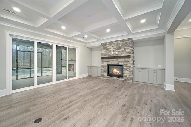 7215 Alexander Rd Unit 4, Charlotte, NC 28270 - unfurnished living room with baseboards, light wood finished floors, a stone fireplace, coffered ceiling, and beamed ceiling