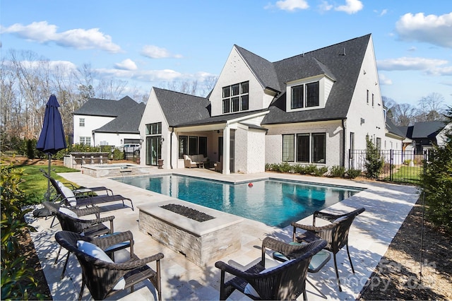 7215 Alexander Rd Unit 4, Charlotte, NC 28270 - view of swimming pool with a patio area, an outdoor living space with a fire pit, and a pool with connected hot tub