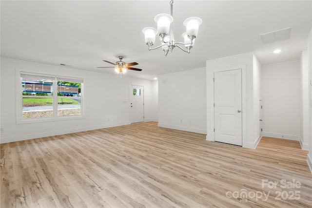 210 N Correll St, Landis, NC 28025 - unfurnished living room featuring ceiling fan, baseboards, light wood-style flooring, and a chandelier