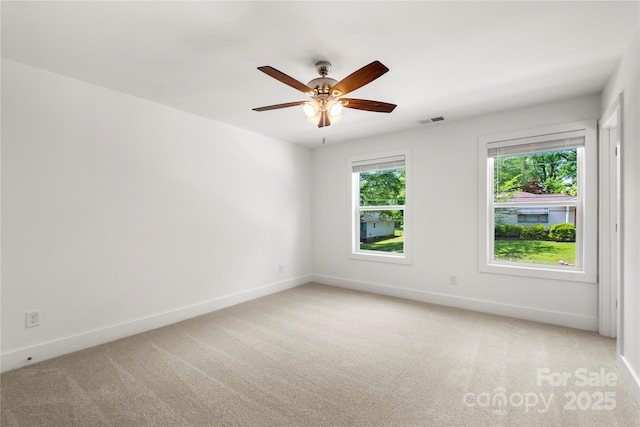 210 N Correll St, Landis, NC 28025 - unfurnished room with light colored carpet, baseboards, and a ceiling fan