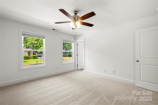 210 N Correll St, Landis, NC 28025 - unfurnished room with light carpet, baseboards, and ceiling fan